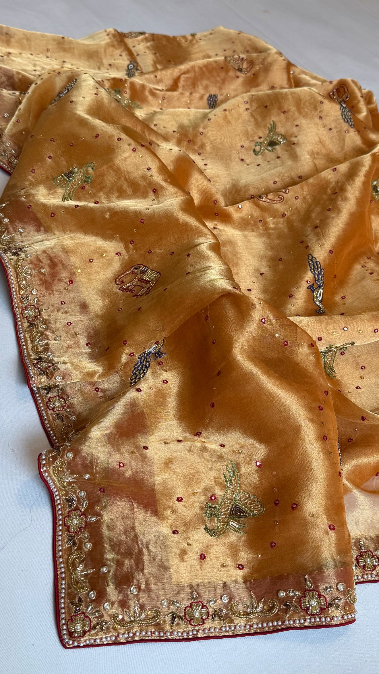 Shikarbagh edit spicy tangerine orange diamond tissue silk hand embroidered kadhwa saree