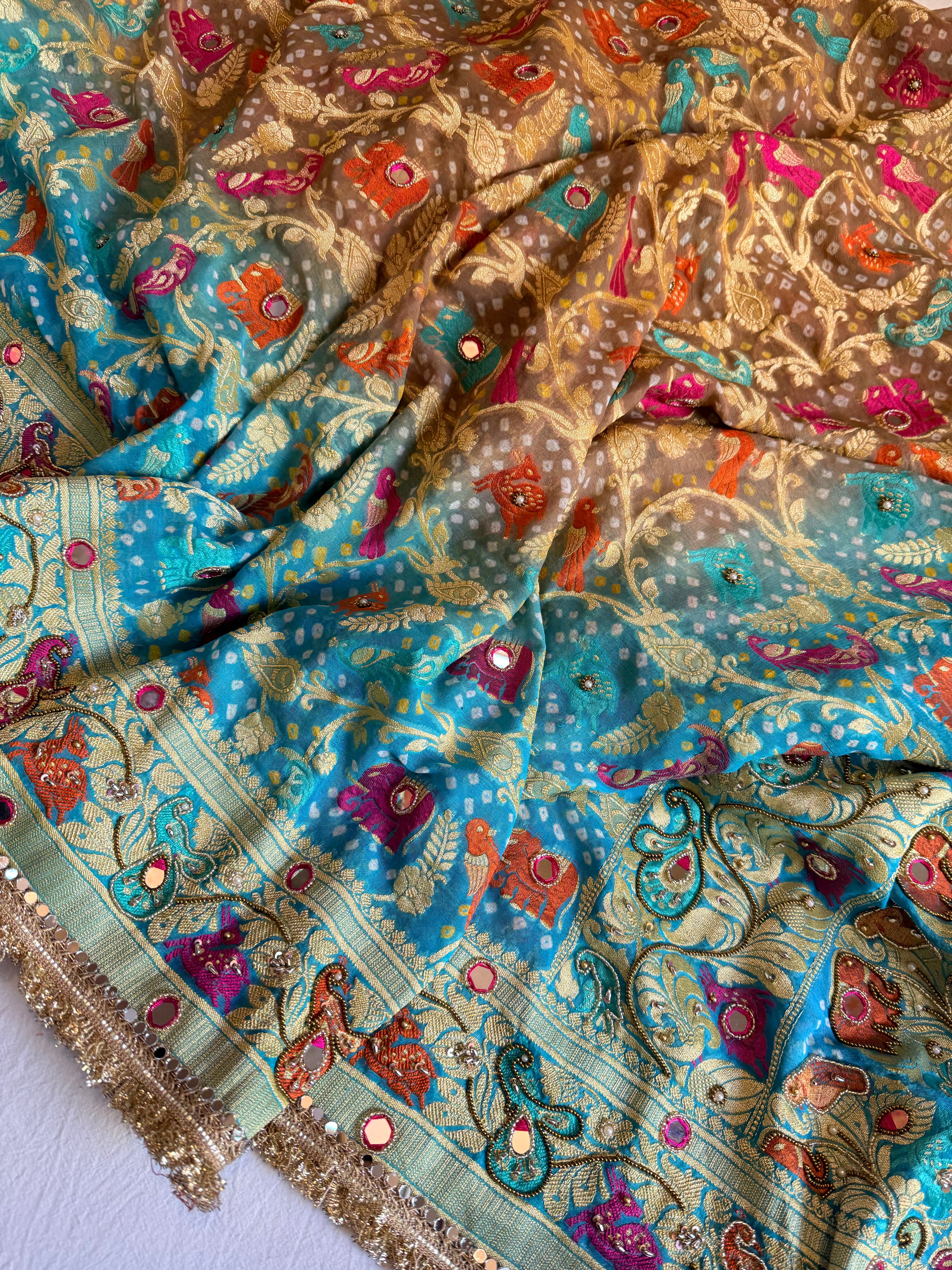 Banarasi blush shades of chiffon rai bandhej mirror work hand embroidered saree