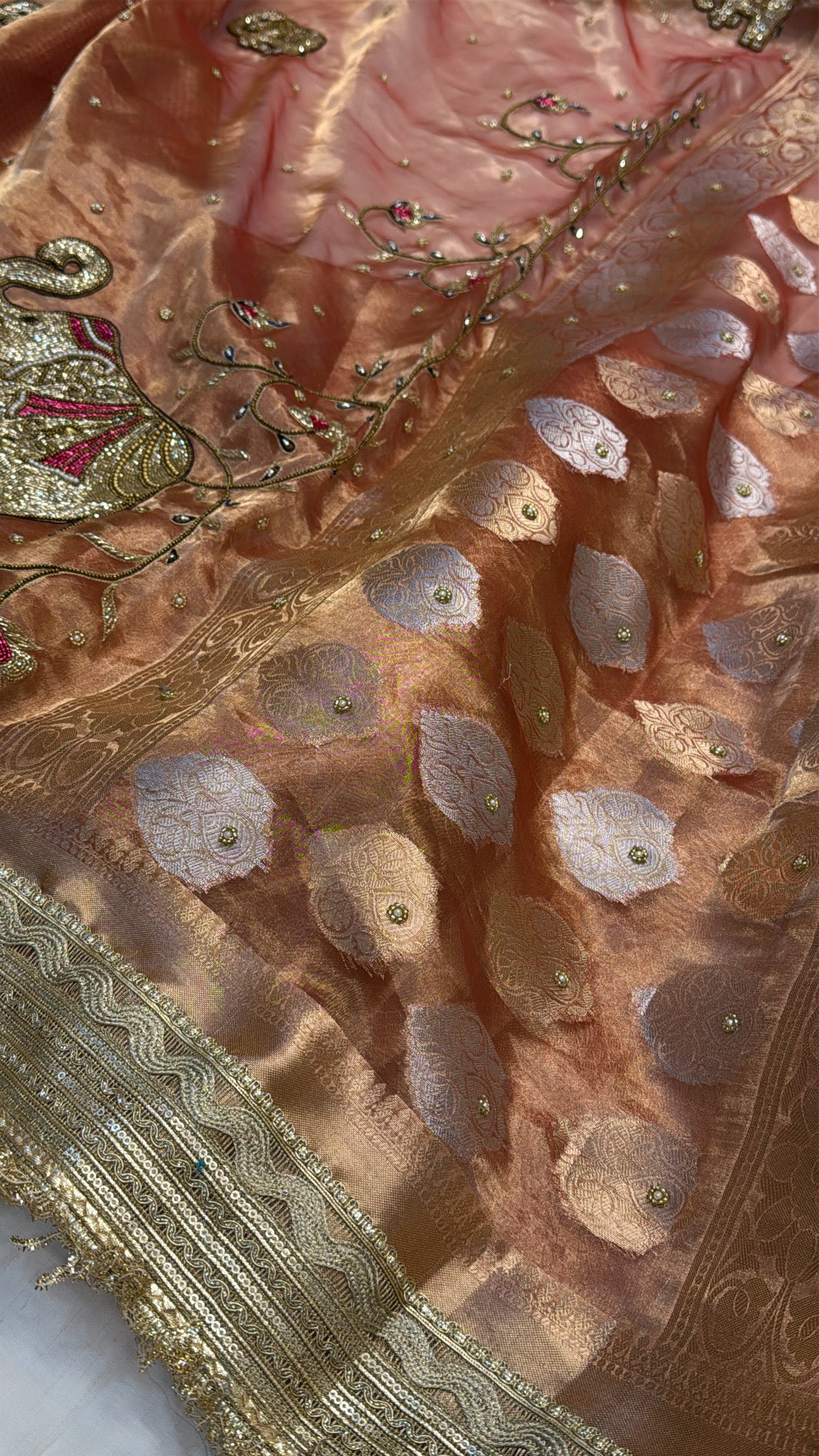 Narangi shade tissue silk dhup chao effect husn hand embroidered kadhwa saree