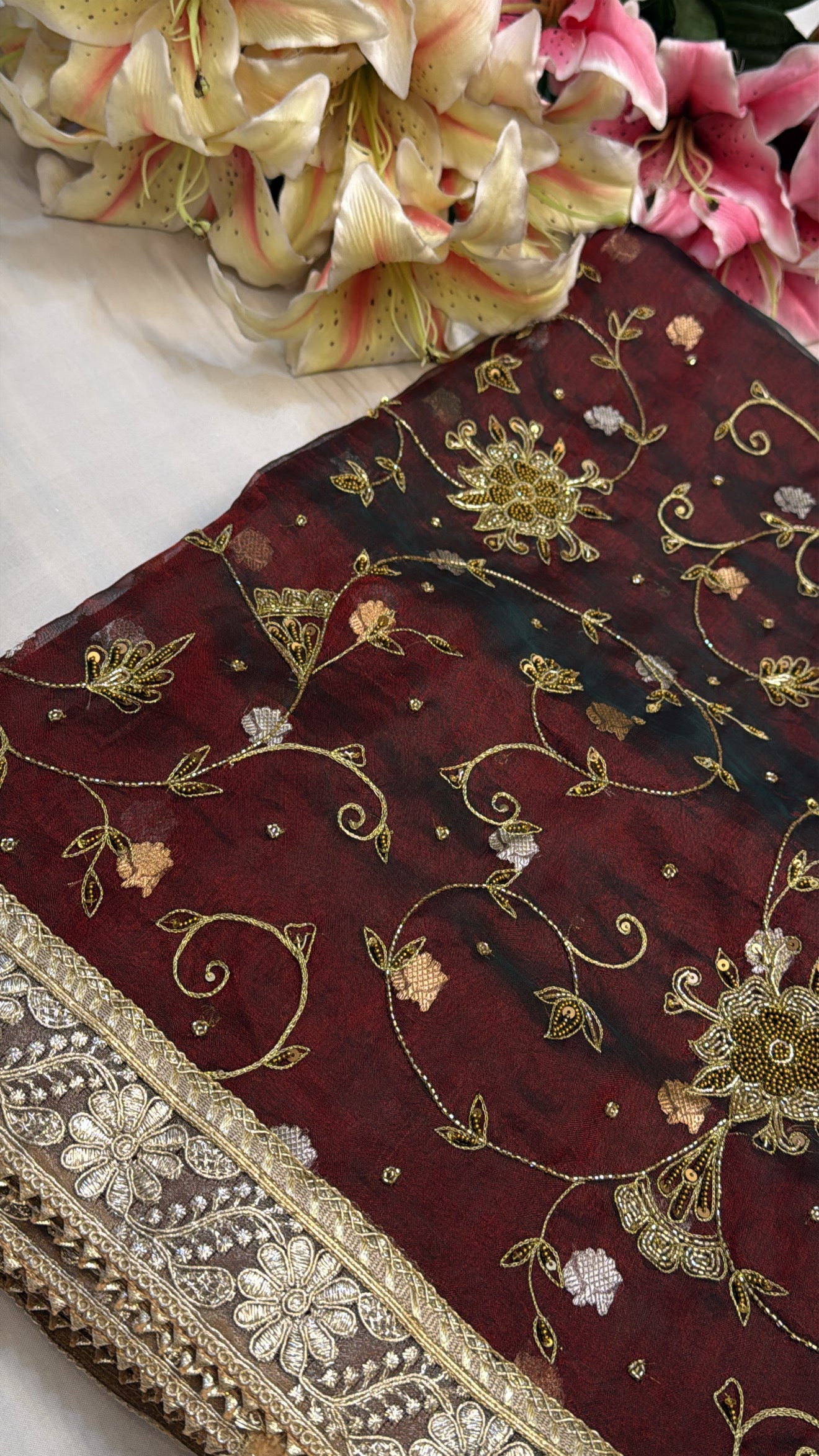Maroonish blood red tissue silk jaalwork hand embroidered kadhwa saree